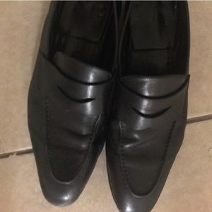 Santoni black leather loafers.